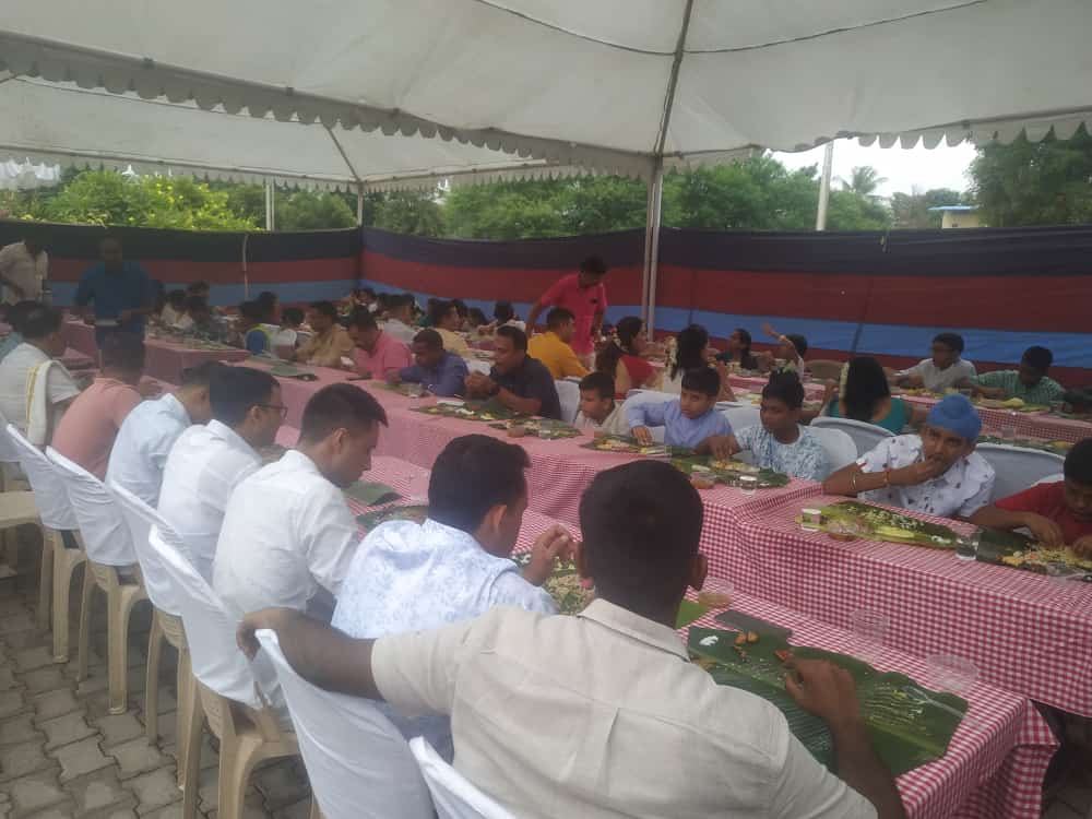 Guests enjoying a full banana-leaf catered meal at a Sri Ushodaya Caterers event
